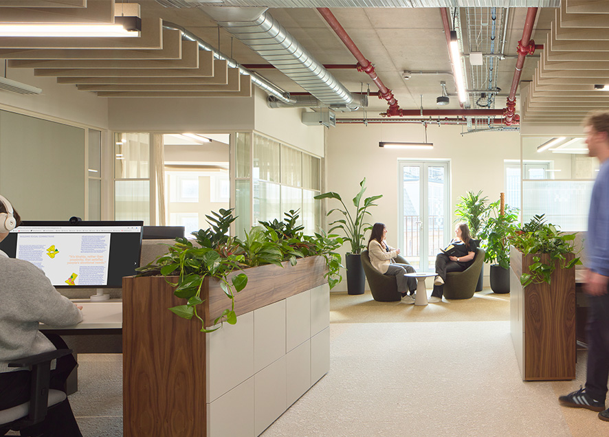 Staff working in open-plan zones at Gleeds London Office featuring sustainable acoustic ceiling solutions from Acoufelt