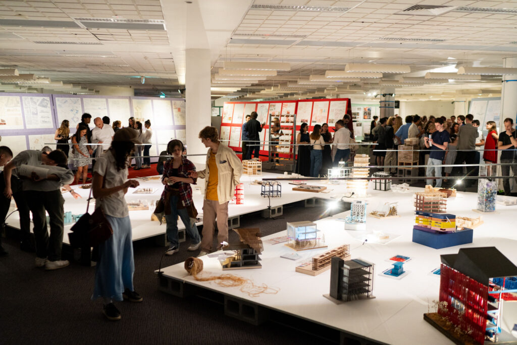 Colorful Acoufelt acoustic panels used as vertical display boards for student work at UTS architecture exhibition