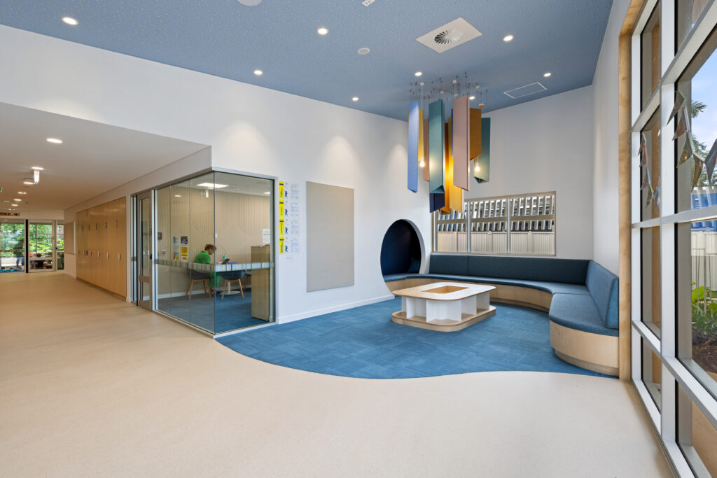 Acoufelt Pendant Ceiling Clouds in Periwinkle, Sea Salt, Turmeric, Valentine, Granite and Wheat installed and Fracture Arch and Solid Wall Panels in Pearl installed in Parap Preschool