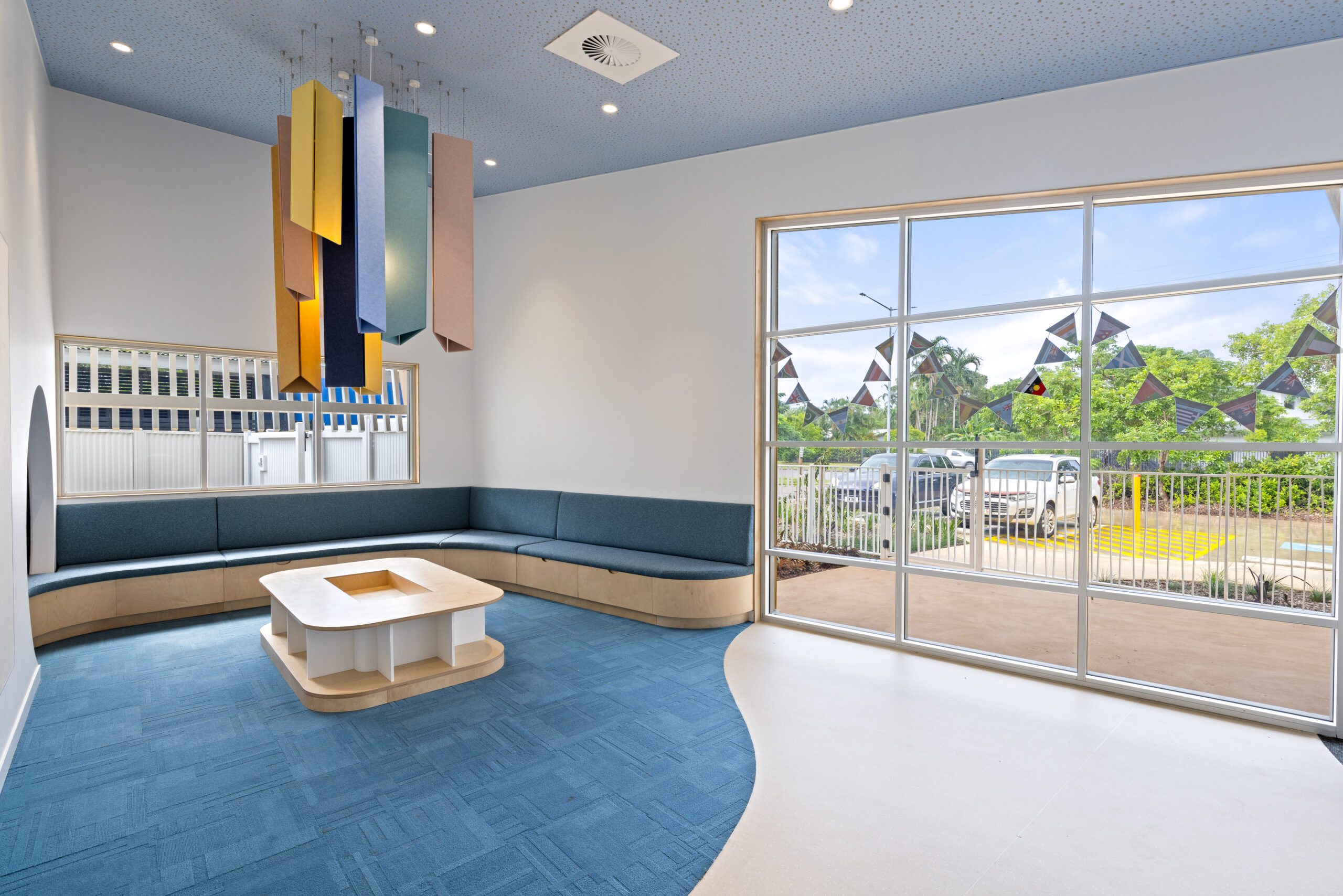 Acoufelt Pendant Ceiling Clouds in Periwinkle, Sea Salt, Turmeric, Valentine, Granite and Wheat installed in Parap Preschool